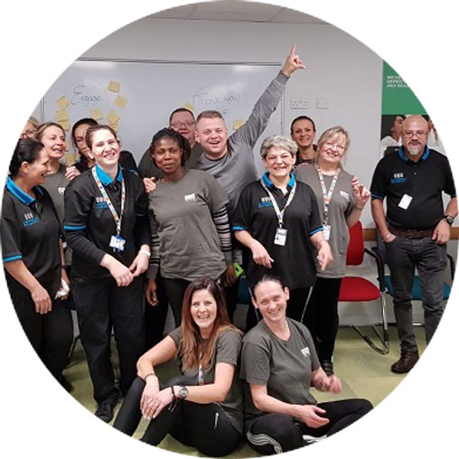 Top-down view of CCS team forming a circle, symbolizing unity